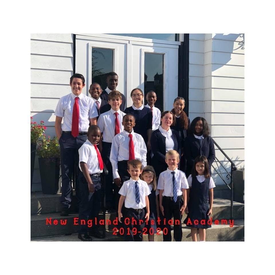 New England Christian Academy students and staff gathered outside the school for the whole-school photo.